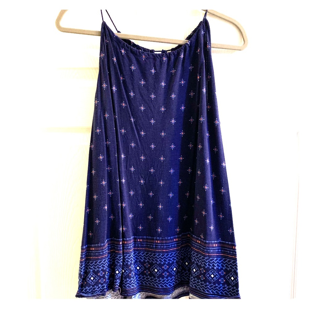 Blue tank top with orange, blue and white design.